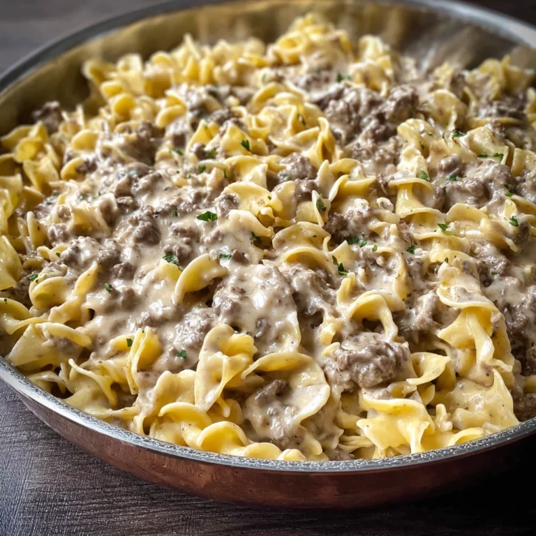 Ground beef stroganoff recipe served over noodles