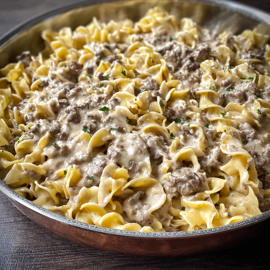 Ground beef stroganoff recipe served over noodles