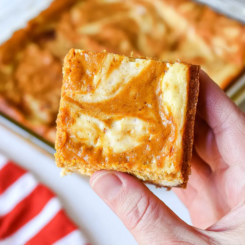 Pumpkin Cheesecake Bars with a Creamy Fall Swirl 5 Pumpkin Cheesecake Bars